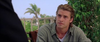 Movie still from “Dark Blue” (2002), directed by Ron Shelton – A person sitting on a chair; Close Up shot, Over the shoulder angle