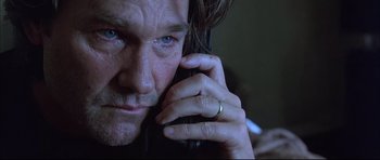 Movie still from “Dark Blue” (2002), directed by Ron Shelton – A person talking on a cell phone; Close Up shot, Low angle