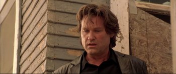 Movie still from “Dark Blue” (2002), directed by Ron Shelton – A person with long hair; Close Up shot, Low angle