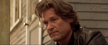 Movie still from “Dark Blue” (2002), directed by Ron Shelton – A person with long brown hair; Close Up shot, Low angle