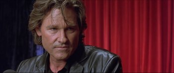 Movie still from “Dark Blue” (2002), directed by Ron Shelton – A person wearing a leather jacket; Close Up shot, Low angle