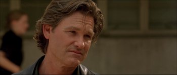 Movie still from “Dark Blue” (2002), directed by Ron Shelton – A person wearing a leather jacket; Close Up shot, Low angle