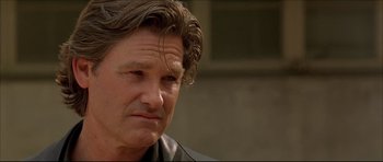 Movie still from “Dark Blue” (2002), directed by Ron Shelton – A person wearing a leather jacket; Close Up shot, Low angle