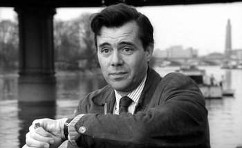 Movie still from “Darling” (1965), directed by John Schlesinger – Black and white photograph of a man in a suit and tie; Close Up shot, Low angle