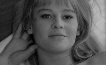 Movie still from “Darling” (1965), directed by John Schlesinger – A person with her hand on her head; Close Up shot, High angle