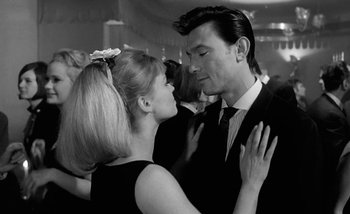 Movie still from “Darling” (1965), directed by John Schlesinger – A man and a woman dancing together in a room; Close Up shot, Low angle