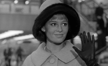 Movie still from “Darling” (1965), directed by John Schlesinger – A black and white photo of a woman wearing a hat; Close Up shot, Low angle