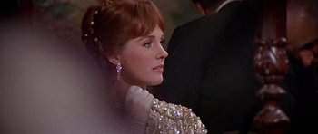 Movie still from “Darling Lili” (1970), directed by Blake Edwards – A person wearing a dress; Close Up shot, Over the shoulder angle