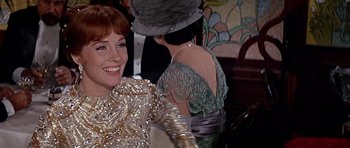 Movie still from “Darling Lili” (1970), directed by Blake Edwards – Two women are sitting at a table in a restaurant; Close Up shot, Over the shoulder angle