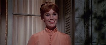 Movie still from “Darling Lili” (1970), directed by Blake Edwards – A person wearing a dress; Close Up shot, Low angle