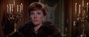 Movie still from “Darling Lili” (1970), directed by Blake Edwards – A person wearing a fur coat; Close Up shot, Over the shoulder angle