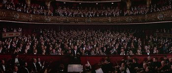 Movie still from “Darling Lili” (1970), directed by Blake Edwards – A large crowd of people in a theater; Extreme Wide shot, High angle