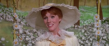 Movie still from “Darling Lili” (1970), directed by Blake Edwards – A person wearing a dress and a hat; Close Up shot, Low angle