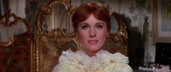 Movie still from “Darling Lili” (1970), directed by Blake Edwards – A person wearing a white dress; Close Up shot, Low angle