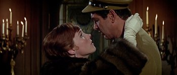 Movie still from “Darling Lili” (1970), directed by Blake Edwards – A man and a woman in a fur coat and hat; Close Up shot, Low angle