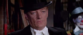 Movie still from “Darling Lili” (1970), directed by Blake Edwards – A person wearing a hat and a bow tie; Close Up shot, Low angle