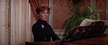 Movie still from “Darling Lili” (1970), directed by Blake Edwards – A woman sitting at a table in front of a mirror; Close Up shot, Over the shoulder angle