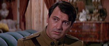 Movie still from “Darling Lili” (1970), directed by Blake Edwards – A person wearing a military uniform; Close Up shot, Over the shoulder angle