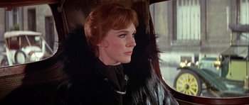 Movie still from “Darling Lili” (1970), directed by Blake Edwards – A person sitting in a car; Close Up shot, Low angle