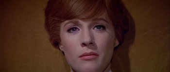 Movie still from “Darling Lili” (1970), directed by Blake Edwards – A woman's face with red hair; Close Up shot, Low angle