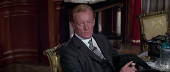 Movie still from “Darling Lili” (1970), directed by Blake Edwards – A person wearing a suit and tie; Close Up shot, High angle