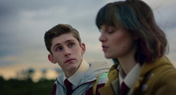 A man and a woman standing next to each other