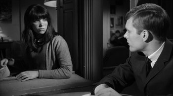 Movie still from “David and Lisa” (1962), directed by Frank Perry – A man and a woman sitting in front of a mirror; Medium shot, Over the shoulder angle