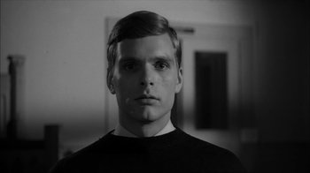 Movie still from “David and Lisa” (1962), directed by Frank Perry – A black and white photo of a man's face; Close Up shot, Low angle