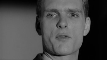 Movie still from “David and Lisa” (1962), directed by Frank Perry – A black - and - white photo of a man's face; Close Up shot, Low angle