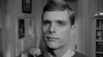 Movie still from “David and Lisa” (1962), directed by Frank Perry – A black and white photo of a man in a room; Close Up shot, Low angle