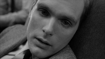 Movie still from “David and Lisa” (1962), directed by Frank Perry – Black and white photograph of a young man's face; Close Up shot, High angle