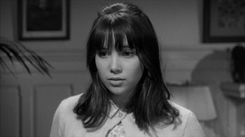 Movie still from “David and Lisa” (1962), directed by Frank Perry – Black and white photograph of a young woman with bangs; Close Up shot, High angle