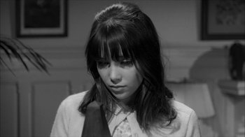 Movie still from “David and Lisa” (1962), directed by Frank Perry – A woman with long black hair wearing a white shirt and a tie; Close Up shot, High angle