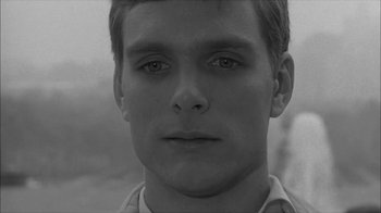 Movie still from “David and Lisa” (1962), directed by Frank Perry – Black and white photograph of a young man's face; Close Up shot, High angle