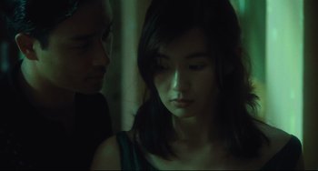Movie still from “Days of Being Wild” (1990), directed by Kar-Wai Wong – A young man and a young woman looking at each other; Close Up shot, Over the shoulder angle