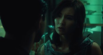 Movie still from “Days of Being Wild” (1990), directed by Kar-Wai Wong – A woman is looking at a man in a dark room; Close Up shot, Over the shoulder angle