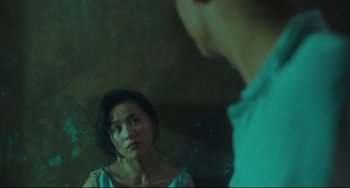 Movie still from “Days of Being Wild” (1990), directed by Kar-Wai Wong – A woman standing next to a man in front of a mirror; Close Up shot, Over the shoulder angle