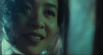 Movie still from “Days of Being Wild” (1990), directed by Kar-Wai Wong – A young woman's face; Extreme Close Up shot, Low angle