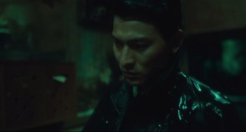 Movie still from “Days of Being Wild” (1990), directed by Kar-Wai Wong – A man in a black jacket is looking at the camera; Close Up shot, High angle