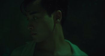 Movie still from “Days of Being Wild” (1990), directed by Kar-Wai Wong – A young man is looking into the distance; Close Up shot, Low angle