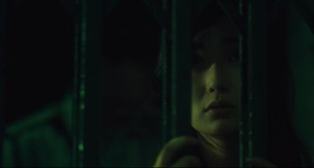 Movie still from “Days of Being Wild” (1990), directed by Kar-Wai Wong – A woman looking out of a window at night; Close Up shot, Low angle