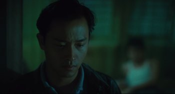 Movie still from “Days of Being Wild” (1990), directed by Kar-Wai Wong – A young man is looking down at his face; Close Up shot, Low angle