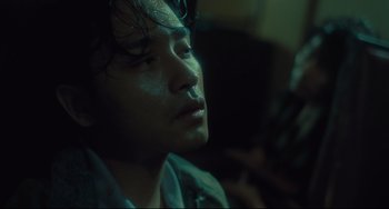 Movie still from “Days of Being Wild” (1990), directed by Kar-Wai Wong – A person looking up at the sky; Close Up shot, Over the shoulder angle