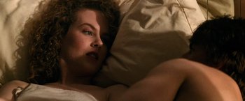 Movie still from “Days of Thunder” (1990), directed by Tony Scott – A woman laying in a bed with her eyes closed; Close Up shot, Overhead angle
