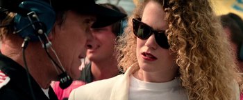 Movie still from “Days of Thunder” (1990), directed by Tony Scott – A person wearing sunglasses; Close Up shot, Over the shoulder angle