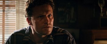 Movie still from “Days of Thunder” (1990), directed by Tony Scott – A person wearing a plaid shirt; Close Up shot, Low angle