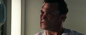 Movie still from “Days of Thunder” (1990), directed by Tony Scott – A man's face in the dark; Close Up shot, Low angle