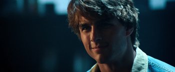 Movie still from “Days of Thunder” (1990), directed by Tony Scott – A young man's face in the dark; Close Up shot, Over the shoulder angle