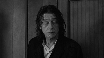 Movie still from “Dead Man” (1995), directed by Jim Jarmusch – Black and white photograph of a man with long hair; Close Up shot, Low angle