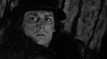 Movie still from “Dead Man” (1995), directed by Jim Jarmusch – A person wearing a hat; Close Up shot, Low angle